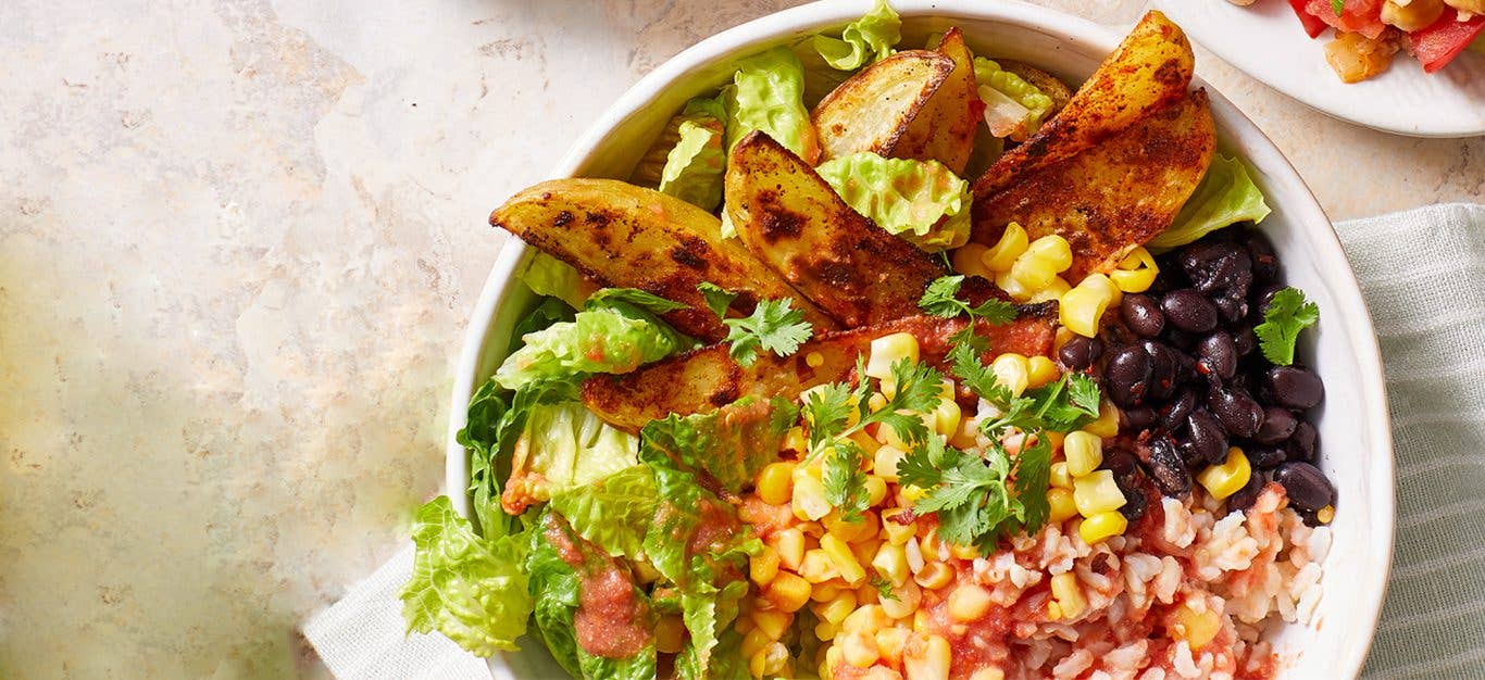 Potato Burrito Bowls with Salsa Fresca in a white bowl