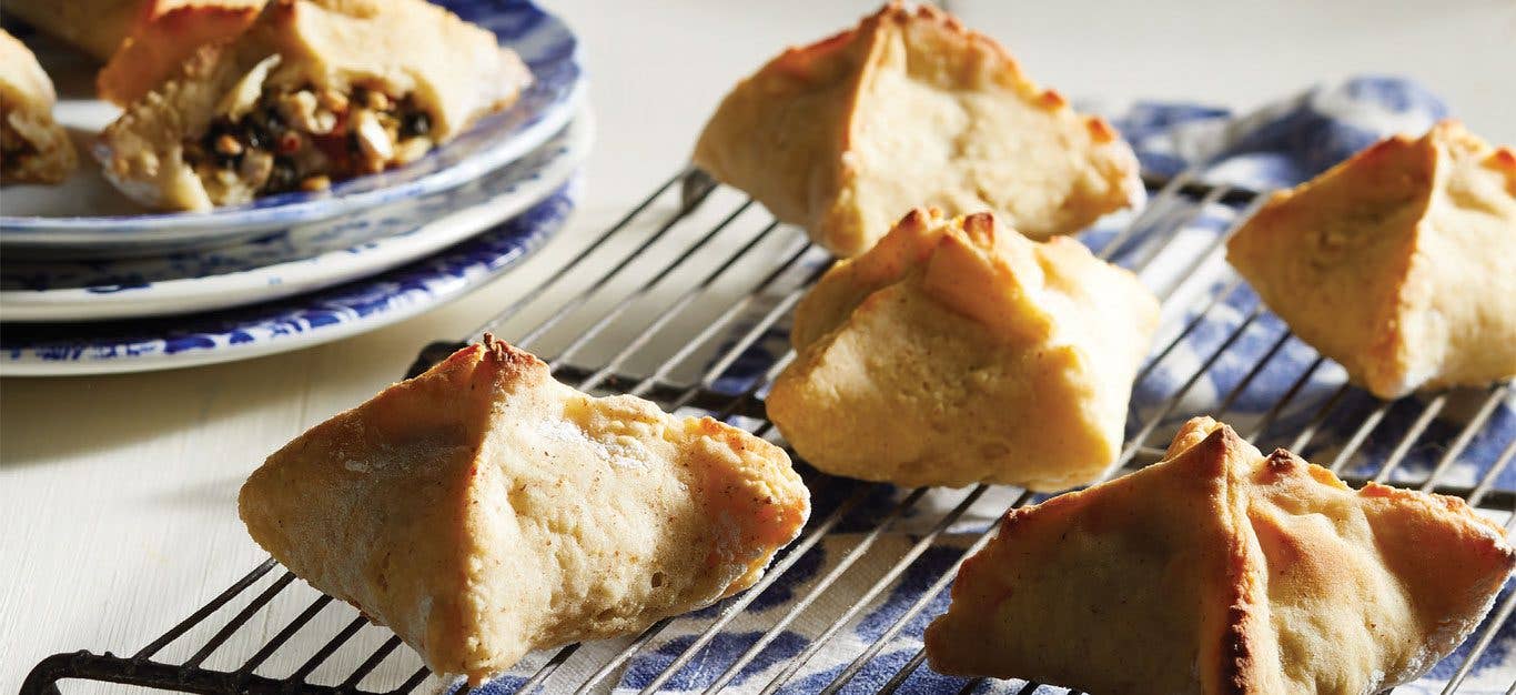 Creamy Vegan Spinach Knishes on a wire cooling rack