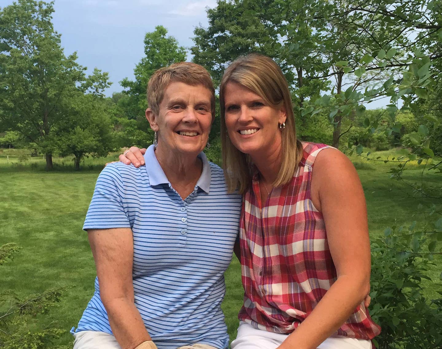 Mallory Taylor and her mother sit together outside, five years after her mother was diagnosed with cancer and adopted a plant-based diet