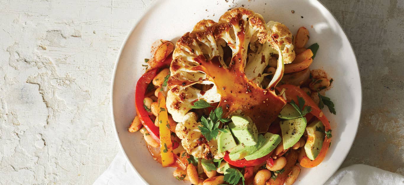 Roasted Cauliflower Planks with Pepper Salad on a white plate