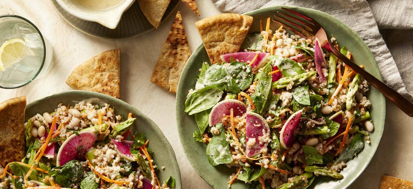 Spinach Tabbouleh Salad with Watermelon Radish on green ceramic plates