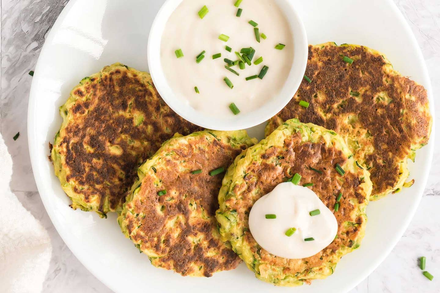 Zucchini fritters with vegan dressing by chef Dreena Burton